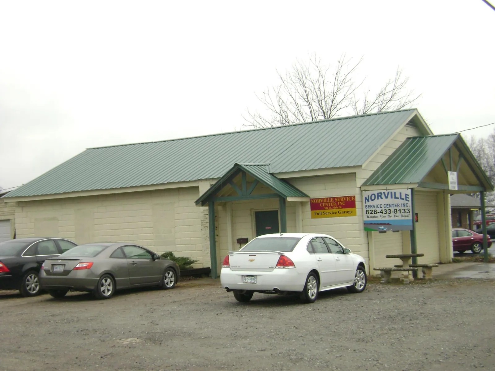 Green metal roof on a service garage with a covered entry in Cape Girardeau